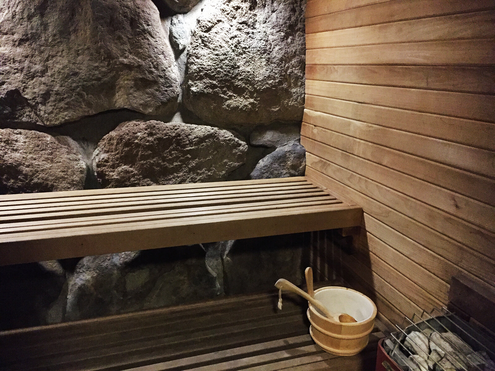 Timberline Lodge sauna with wooden benches and a stone heater